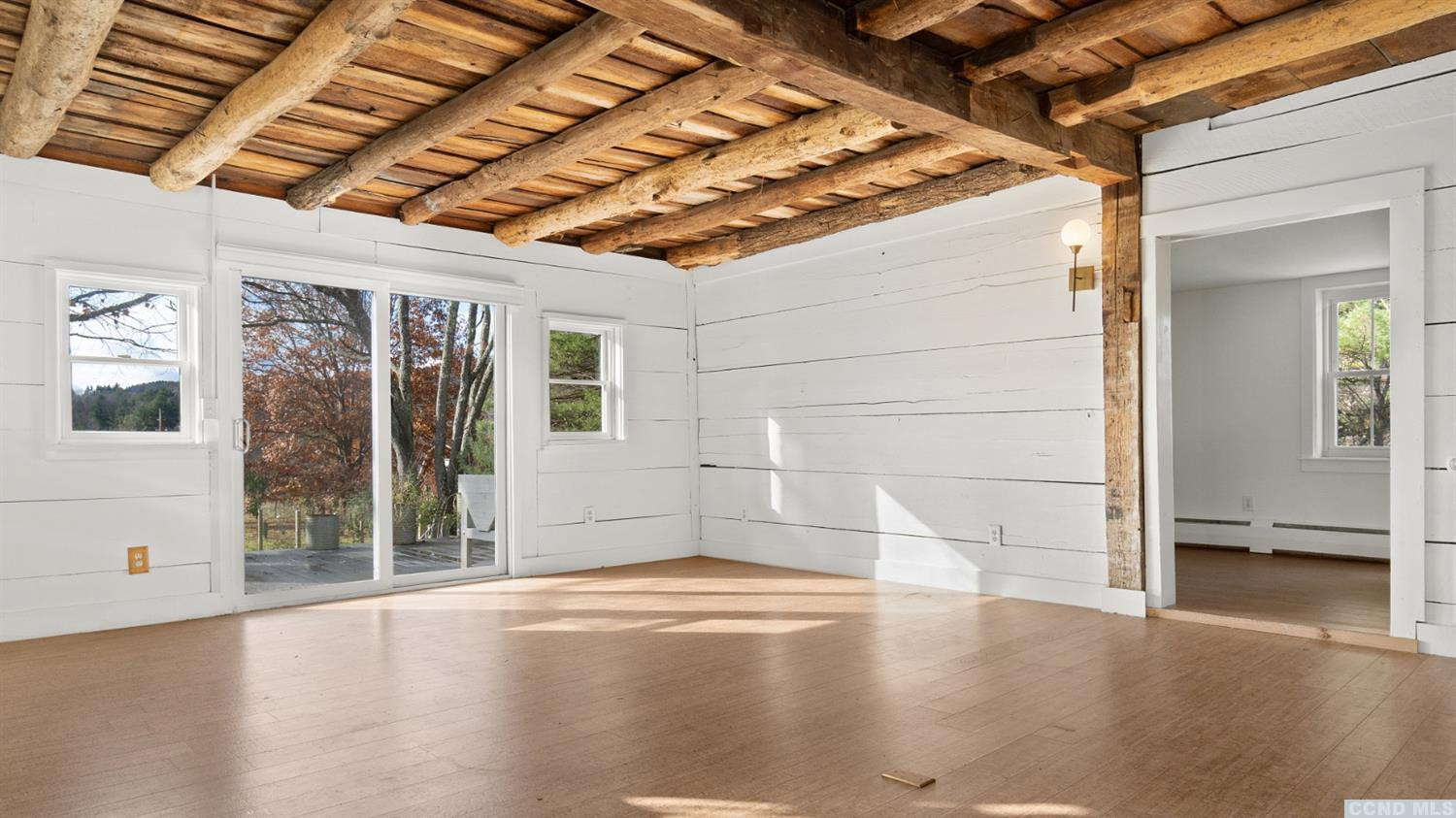 18 Old Queechy Road Canaan, NY 12029 - Photo 14 of 52 an empty room with wooden floor and windows
