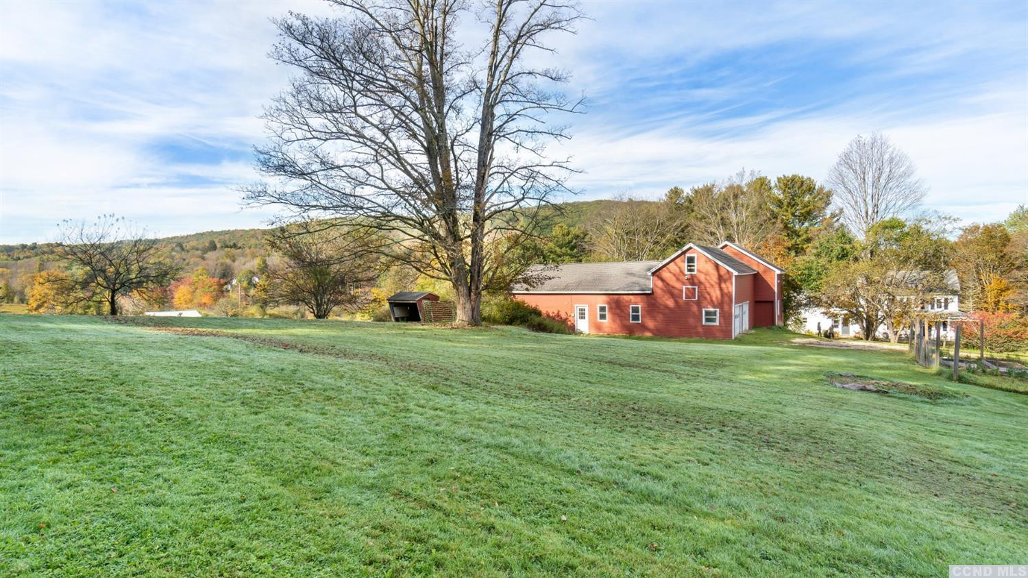 18 Old Queechy Road Canaan, NY 12029 - Photo 7 of 52 a yellow and red house with a big yard and large trees