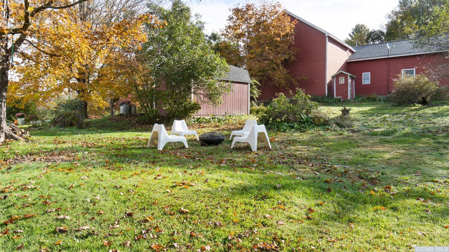 18 Old Queechy Road Canaan, NY 12029 - Photo 8 of 52 a backyard of a house with table and chairs