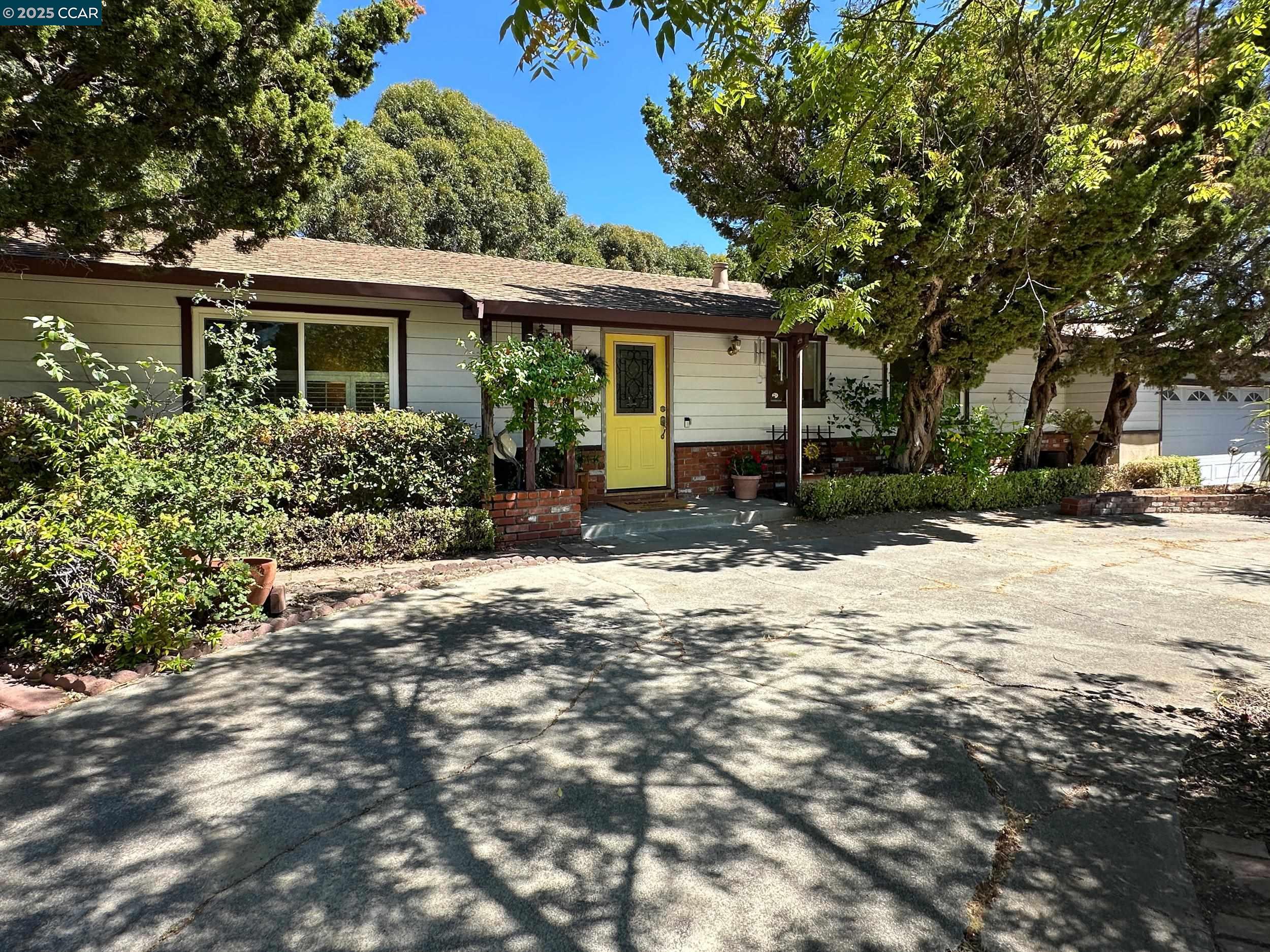 3078 Diablo View Road Lafayette, CA 94549 - Photo 1 of 1 a front view of a house with a yard and potted plants
