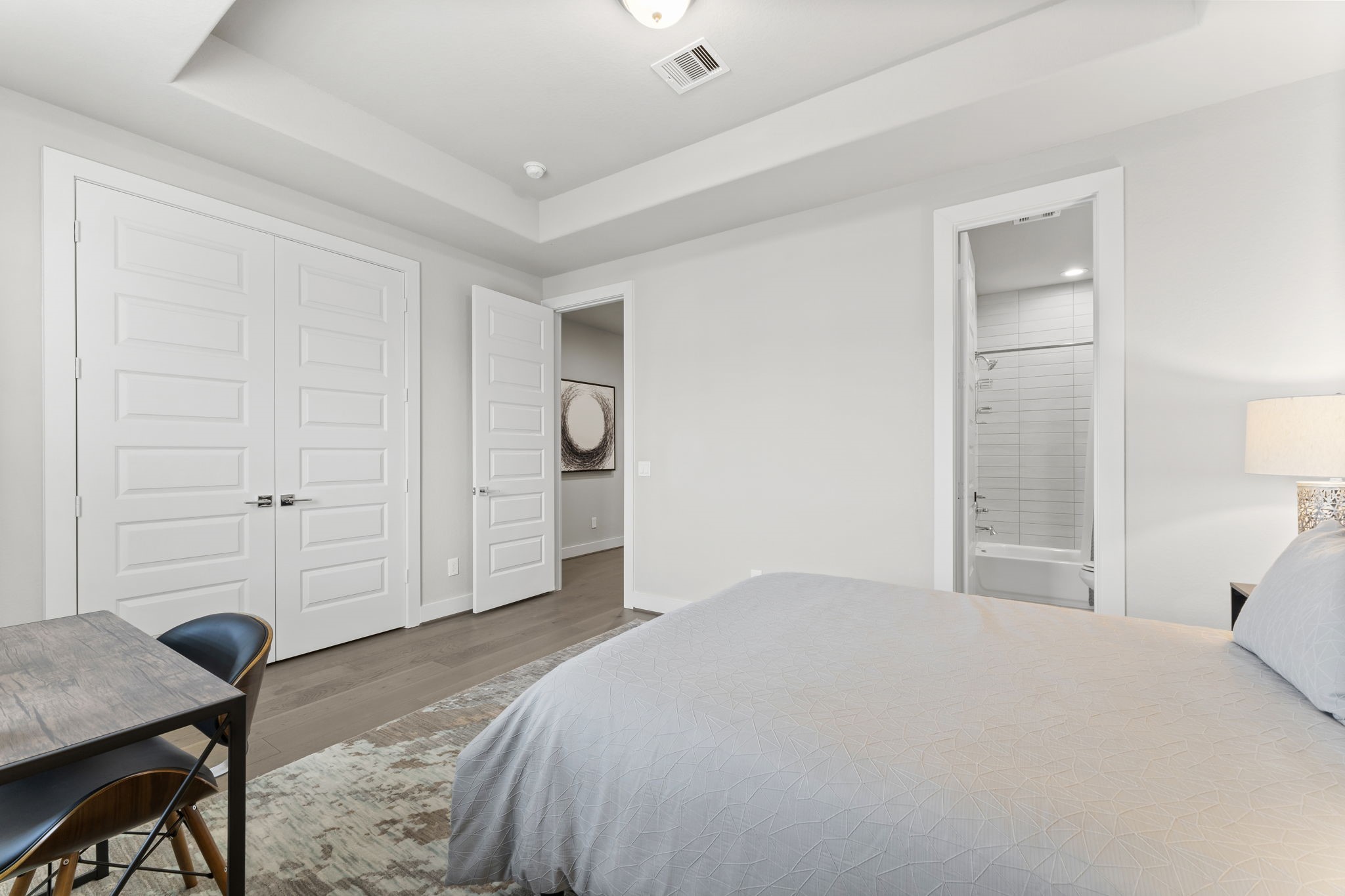 4227 Allen Street Houston, TX 77007 - Photo 27 of 30 a bedroom with a bed and a table