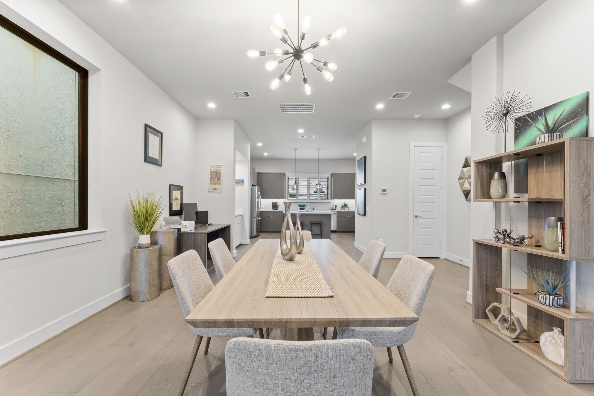 4227 Allen Street Houston, TX 77007 - Photo 9 of 30 a view of a dining room with furniture and a chandelier