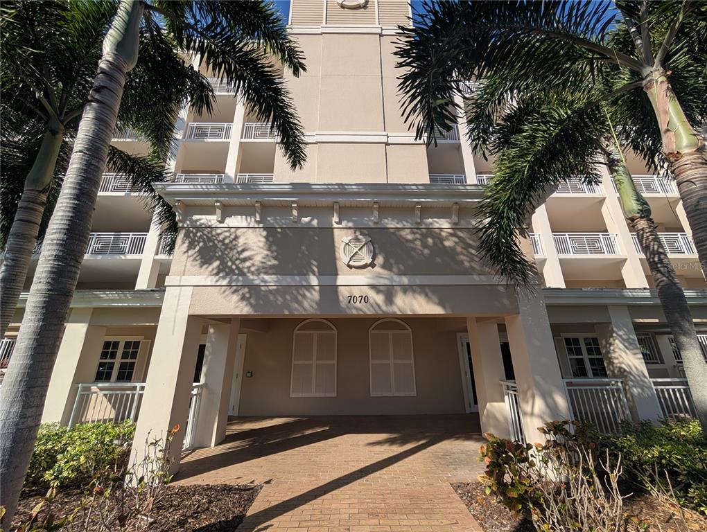 7070 Key Haven Road, Unit 602 Seminole, FL 33777 - Photo 12 of 48 a front view of a house with plants