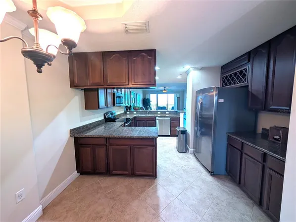 a kitchen with stainless steel appliances a refrigerator and a sink