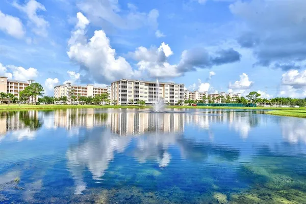 a view of a lake with a yard