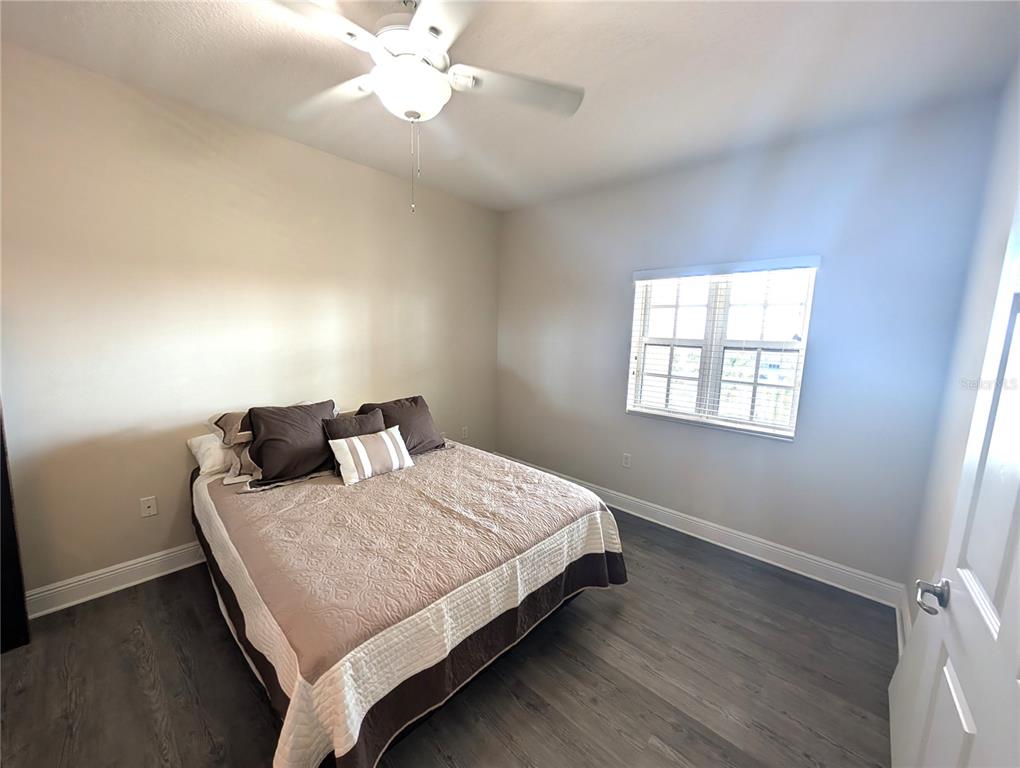 7070 Key Haven Road, Unit 602 Seminole, FL 33777 - Photo 31 of 48 a bedroom with a bed and window