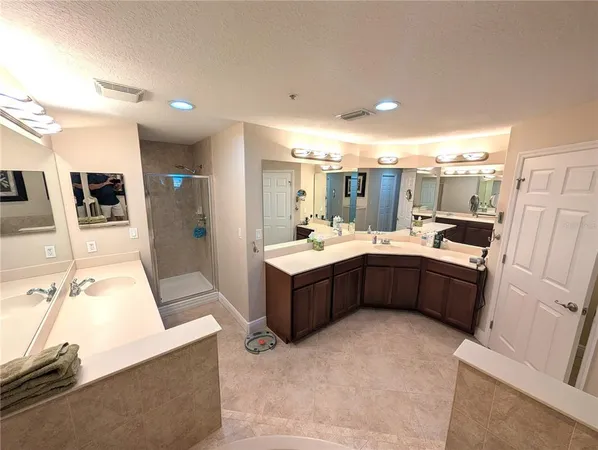 a kitchen with a sink counter top space and stainless steel appliances