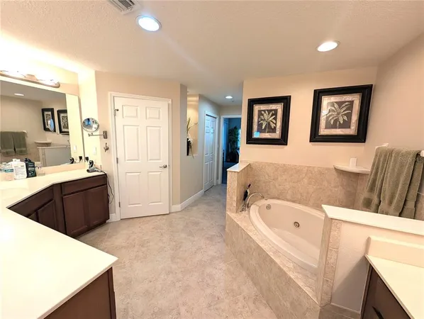 a room with a sink vanity and a mirror