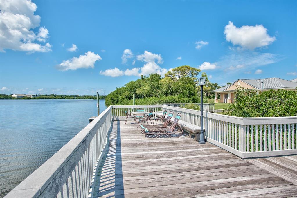 7070 Key Haven Road, Unit 602 Seminole, FL 33777 - Photo 6 of 48 a view of a balcony with two chairs