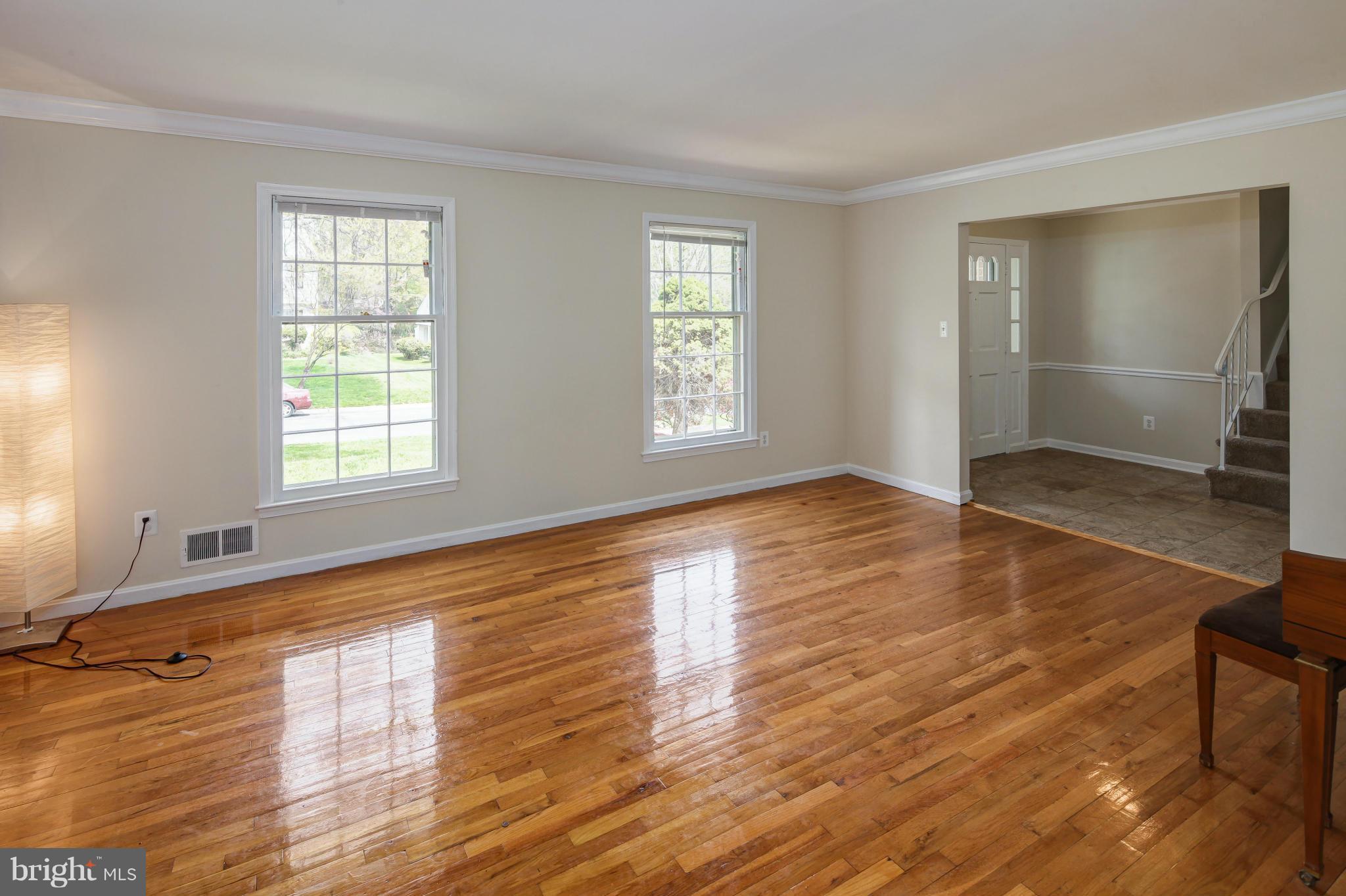 1530 Arbor View Road Silver Spring, MD 20902 - Photo 2 of 30 an empty room with wooden floor and windows