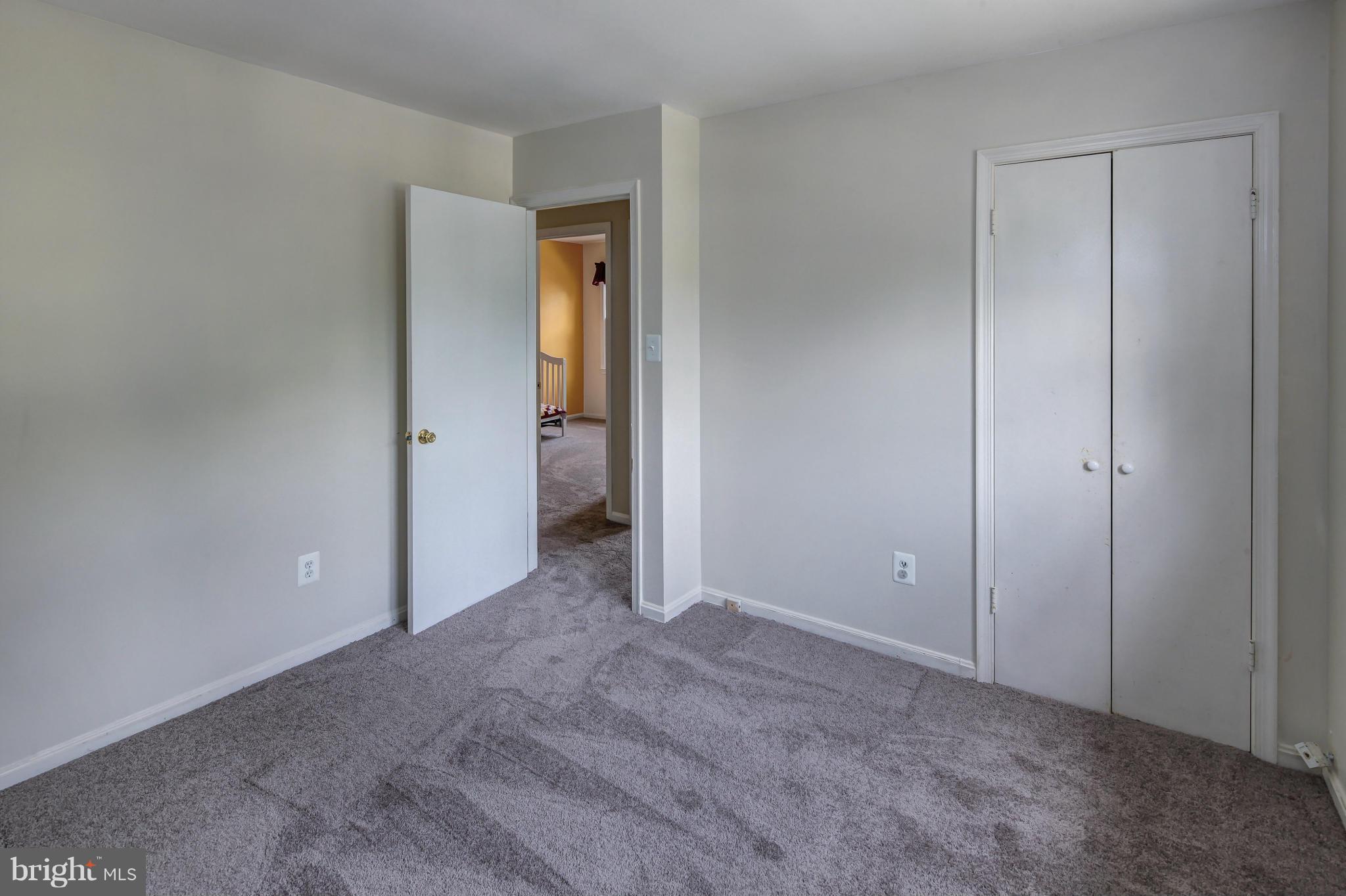 1530 Arbor View Road Silver Spring, MD 20902 - Photo 21 of 30 a view of a room with an empty space and wooden shelves
