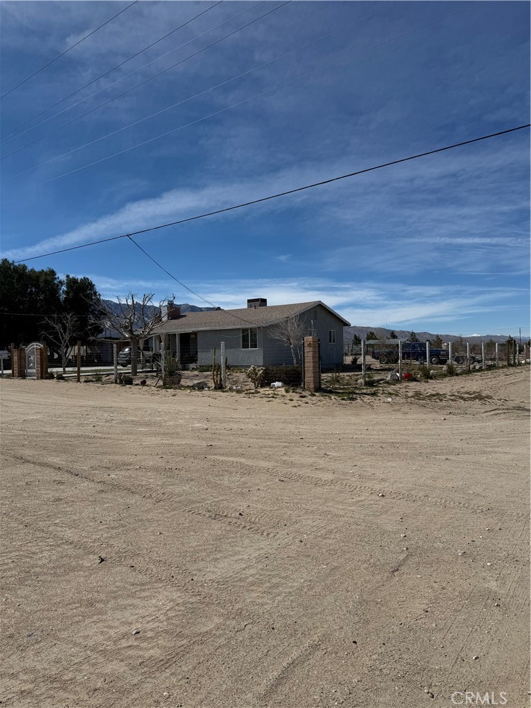 a view of a car park in front of a house