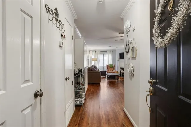 a view of a livingroom with furniture and hardwood floor