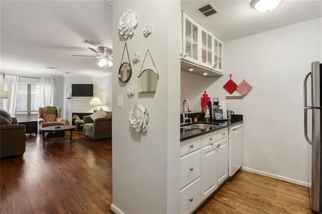 a kitchen with stainless steel appliances granite countertop a stove and cabinets