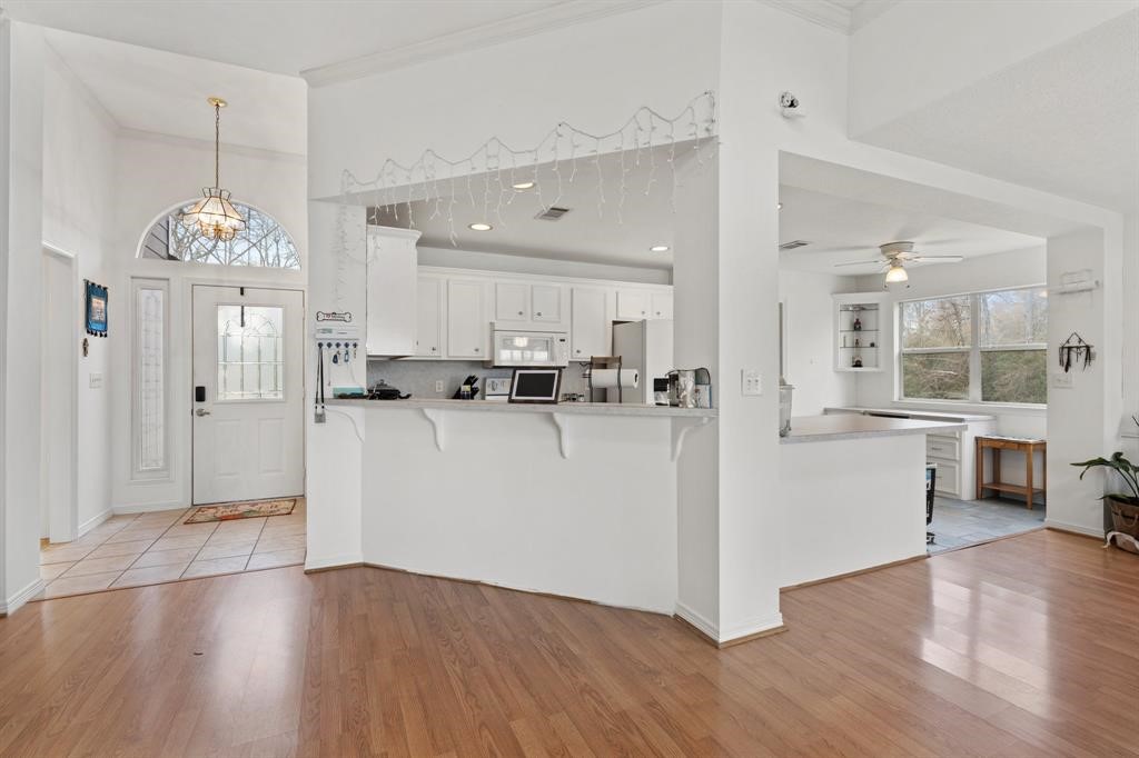 467 Pinnacle Trinity, TX 75862 - Photo 17 of 40 a view of kitchen with stainless steel appliances refrigerator stove microwave and cabinets