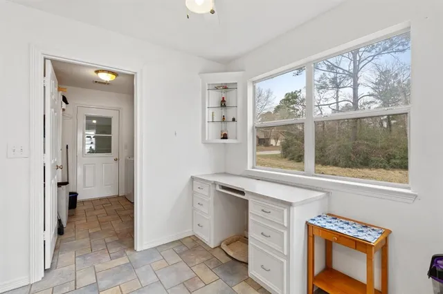 a view of a kitchen cabinets a sink and a window