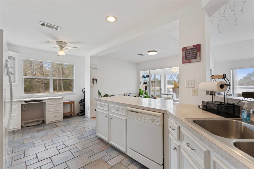 467 Pinnacle Trinity, TX 75862 - Photo 22 of 40 a kitchen with a sink cabinets and window