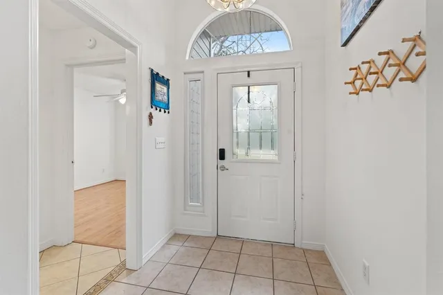 view of an entryway with a chandelier