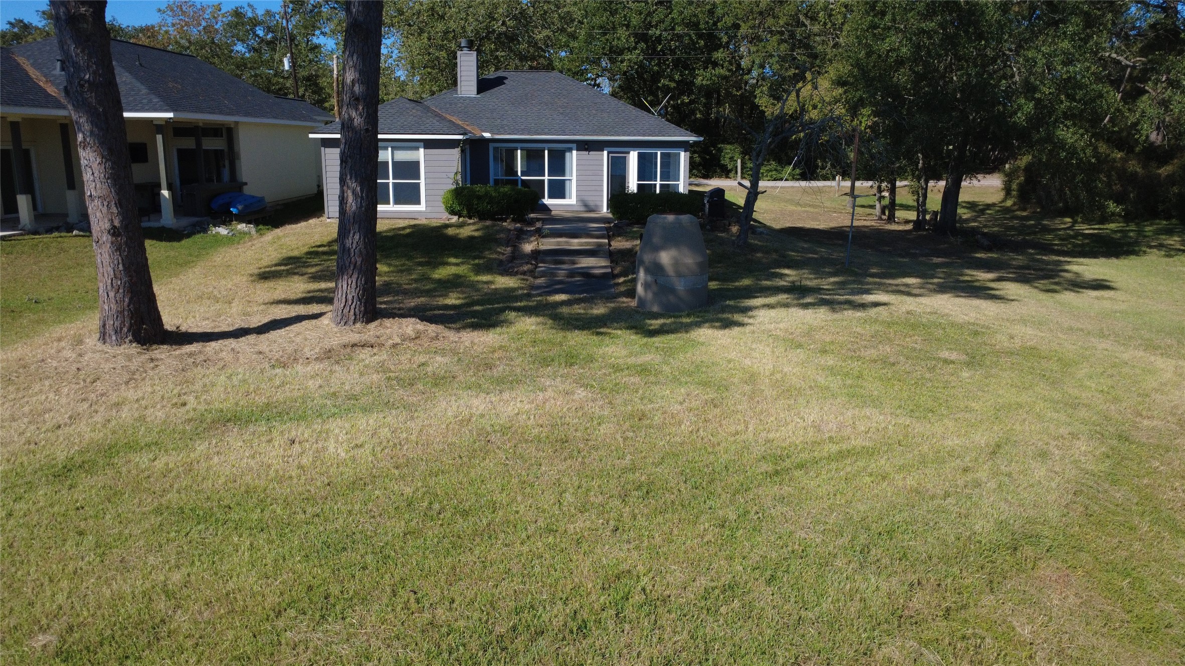 467 Pinnacle Trinity, TX 75862 - Photo 36 of 40 a front view of a house with a yard covered with snow and trees