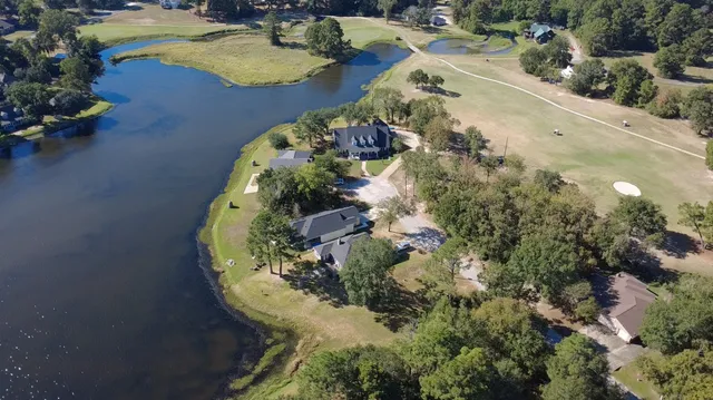 a aerial view of a house with a yard and garden