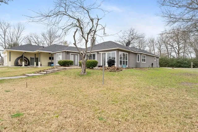 a front view of a building with garden