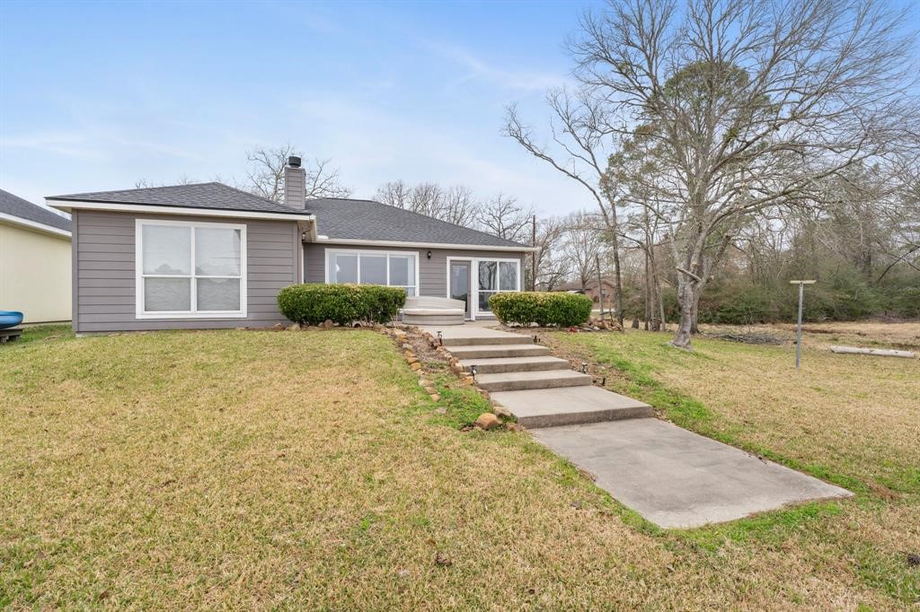 467 Pinnacle Trinity, TX 75862 - Photo 5 of 40 a front view of a house with a yard