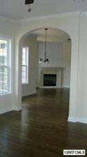 507 Quicksilver Trail, Unit 35 Fort Mill, SC 29708 - Photo 2 of 7 an empty room with wooden floor fireplace and windows