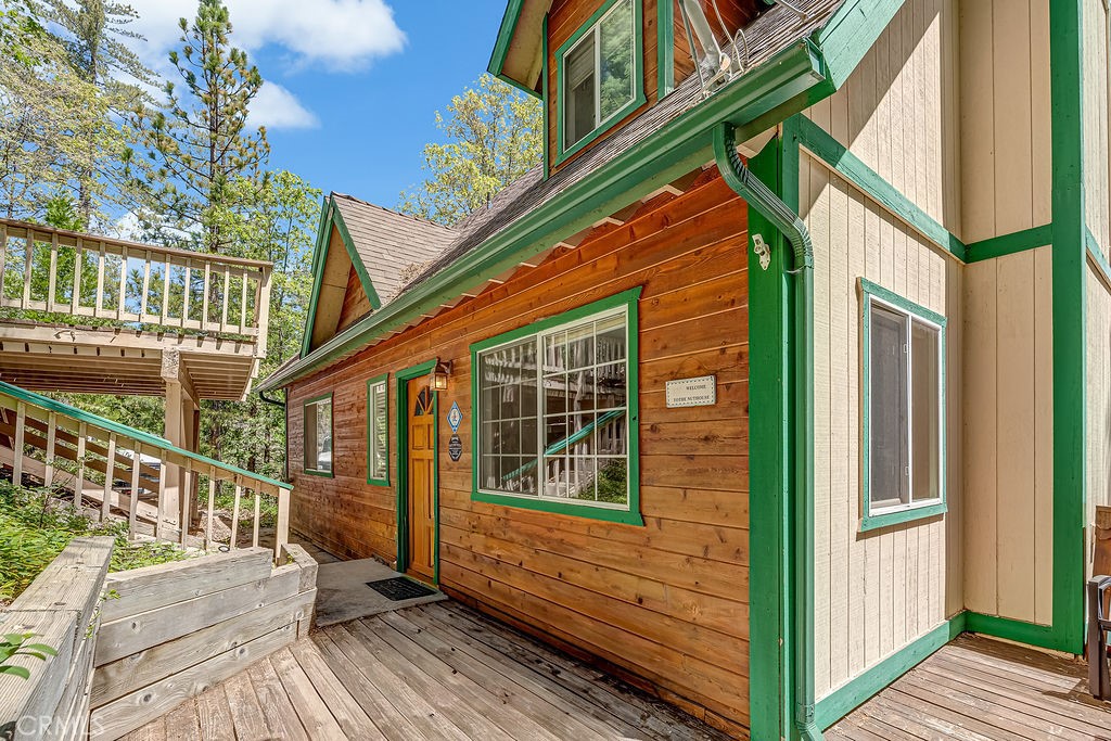 318 Old Toll Road Lake Arrowhead, CA 92352 - Photo 3 of 44 a view of a house with a small deck