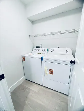 an empty room with fan and windows