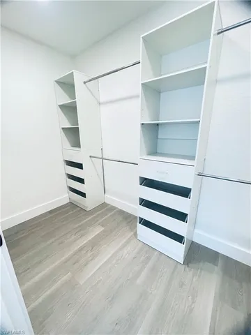 a bathroom with a double vanity sink mirror and shower