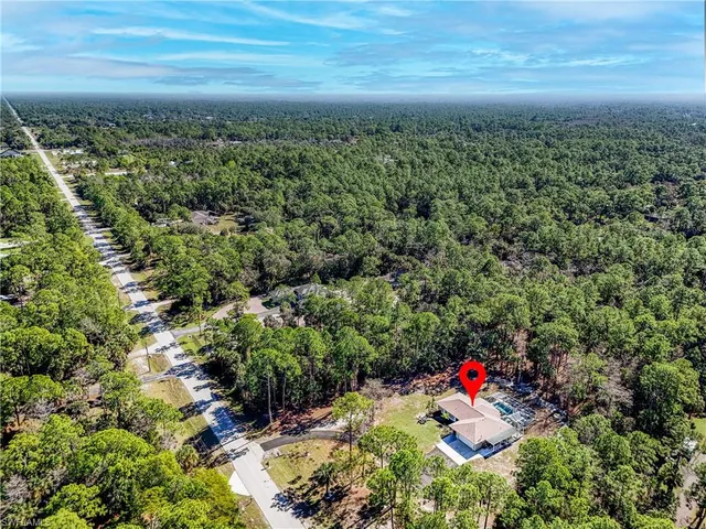 a view of a swimming pool with a yard