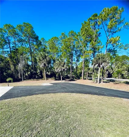 an aerial view of a houses with a yard