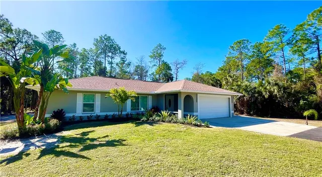 a view of a swimming pool with an outdoor space and seating area