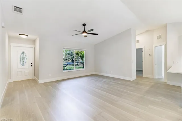 a view of a kitchen with a sink and a window