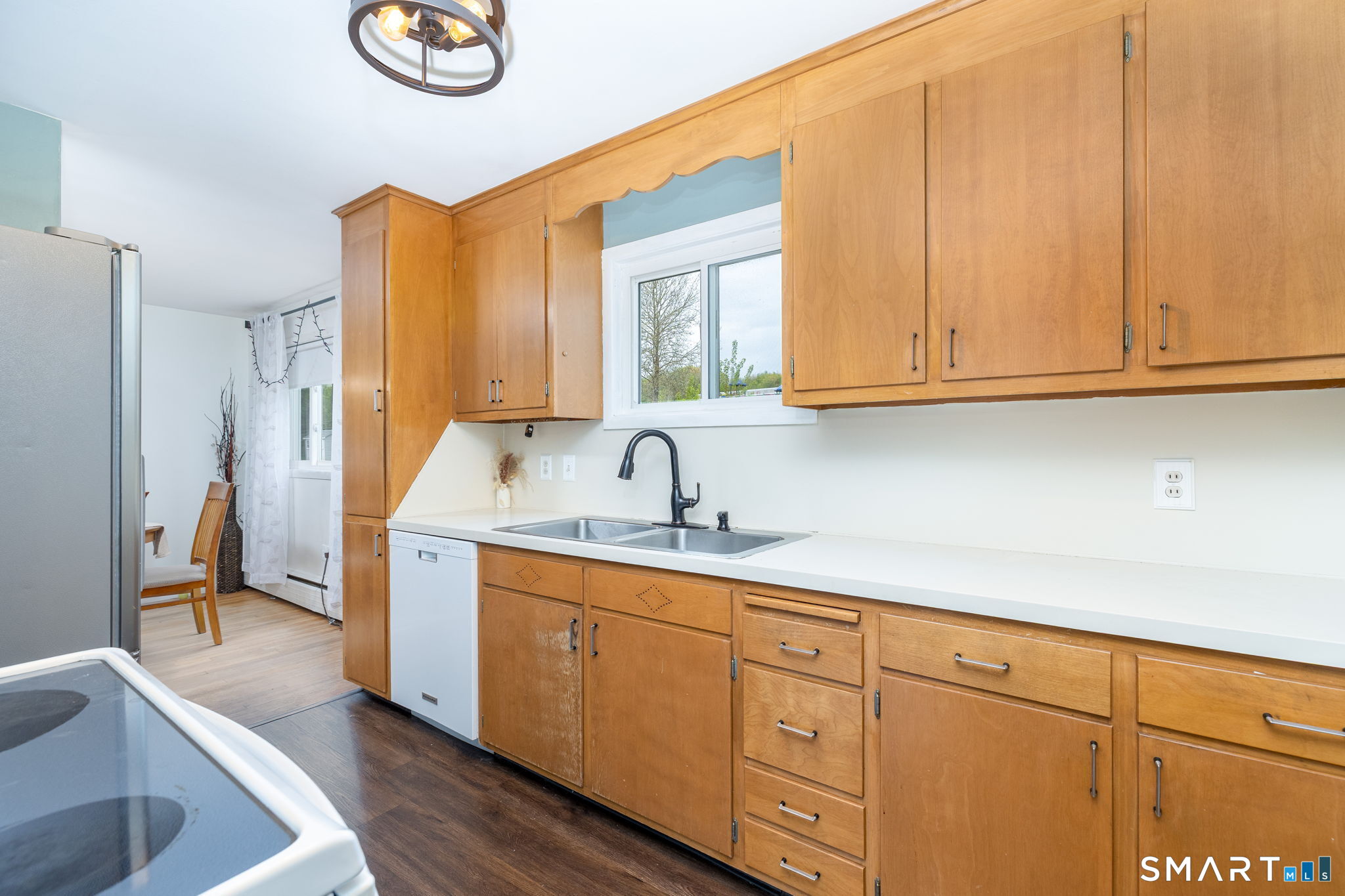 325 Barbara Road Middletown, CT 06457 - Photo 11 of 40 a kitchen with stainless steel appliances granite countertop a sink and a white cabinets