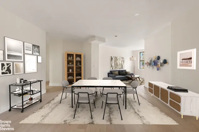 a view of a dining room with furniture and window