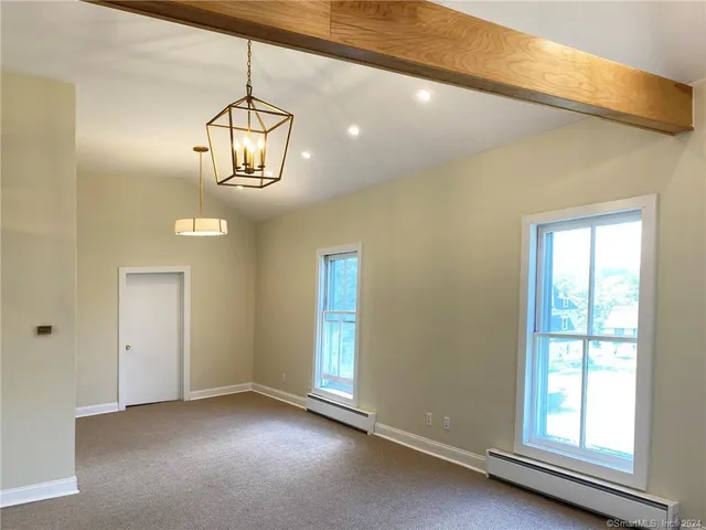 a view of empty room with windows