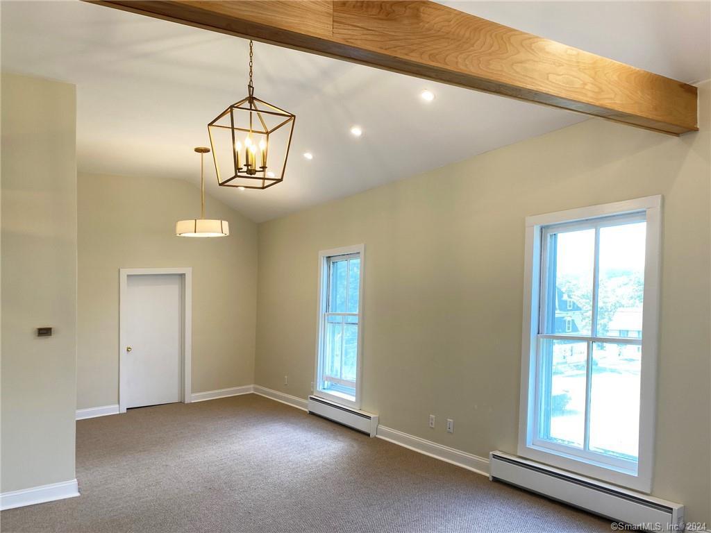 a view of empty room with windows