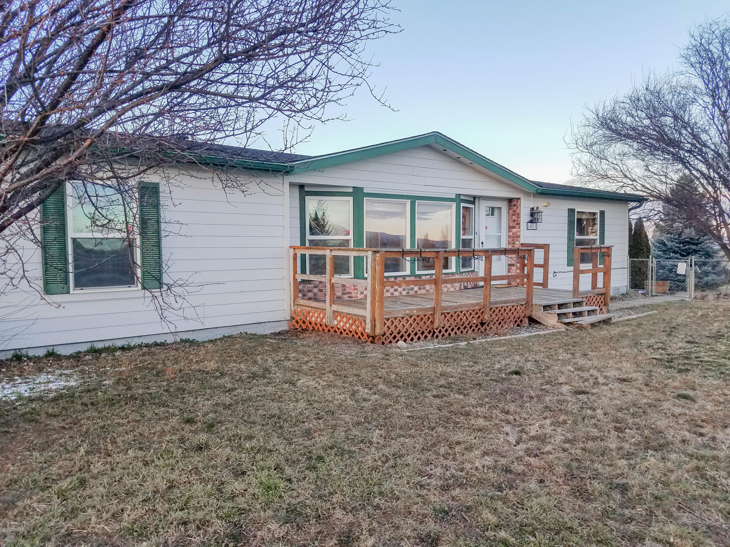 14811 Douglas Road Yakima, WA 98908 - Photo 2 of 18 a view of a house with a yard