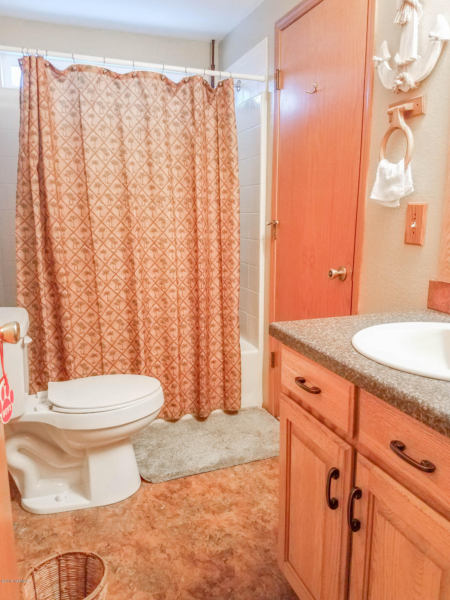 14811 Douglas Road Yakima, WA 98908 - Photo 14 of 18 a bathroom with a granite countertop toilet and a sink