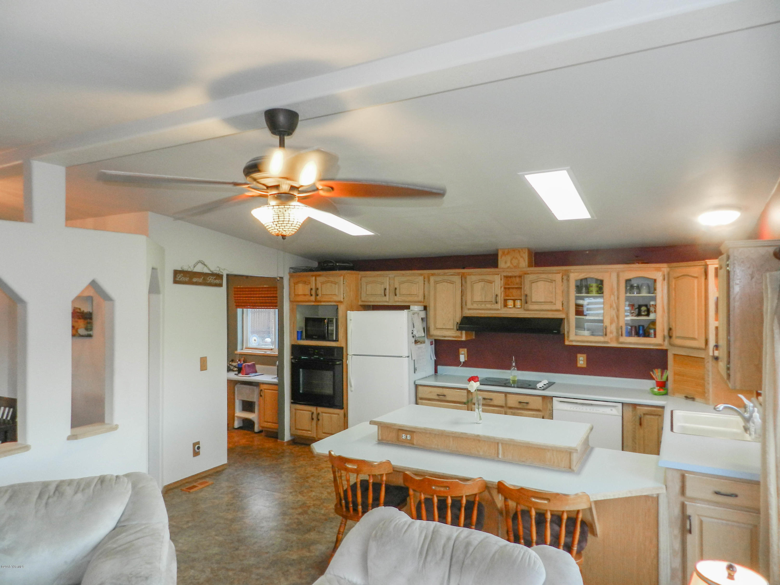 14811 Douglas Road Yakima, WA 98908 - Photo 18 of 18 a living room with stainless steel appliances kitchen island granite countertop furniture and a large window