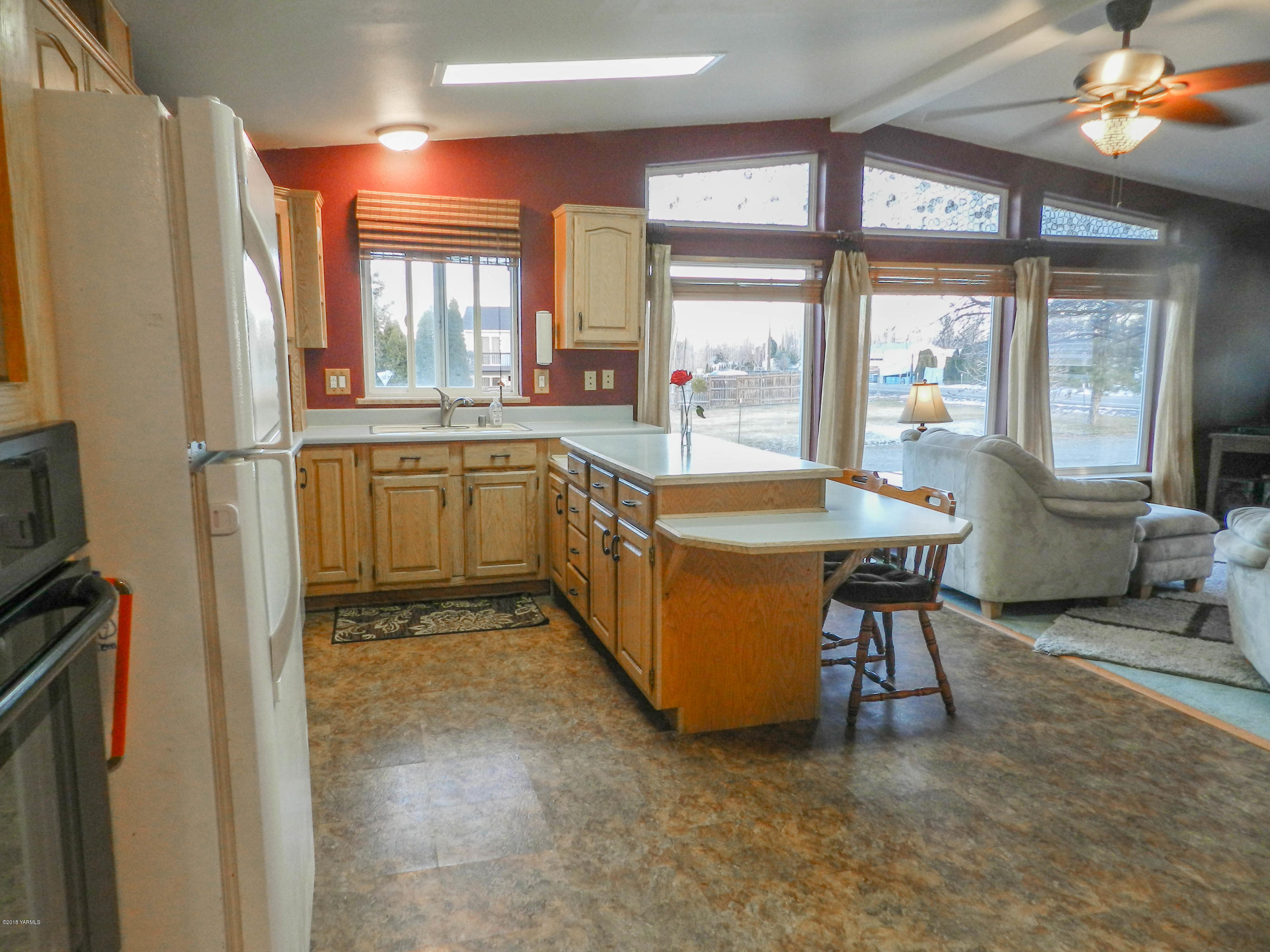 14811 Douglas Road Yakima, WA 98908 - Photo 6 of 18 a kitchen with sink refrigerator and window