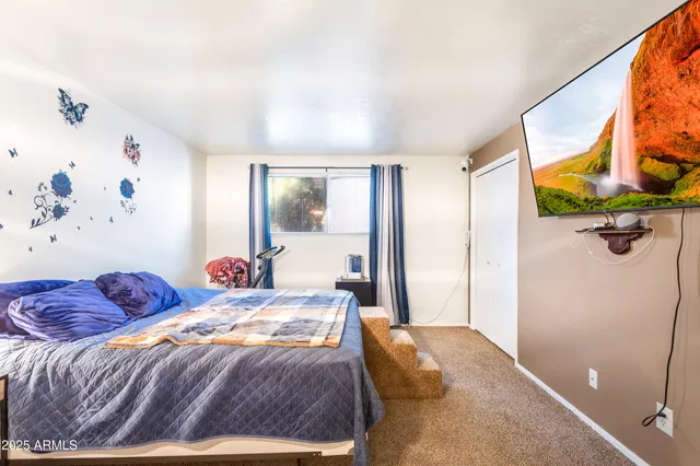 a bathroom with a sink a toilet and shower curtain