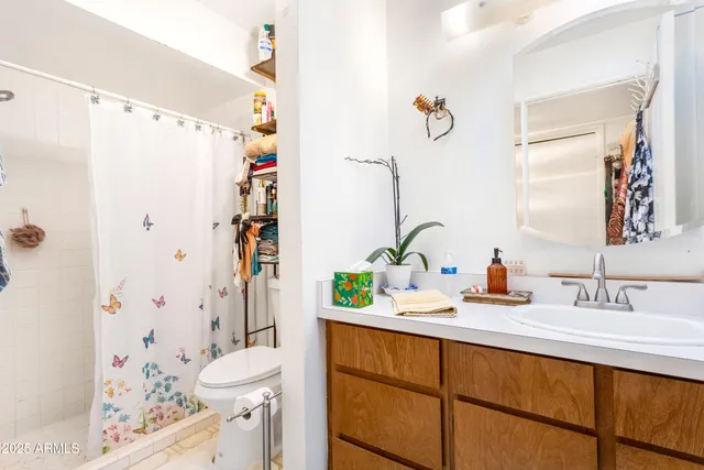 a utility room with toys and wooden floor