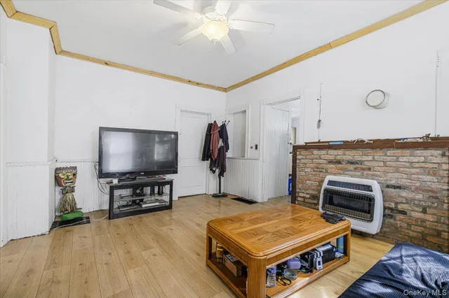 a view of a livingroom with furniture and a flat screen tv