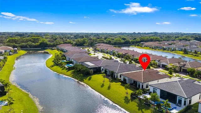 an aerial view of a house with a swimming pool yard and outdoor seating