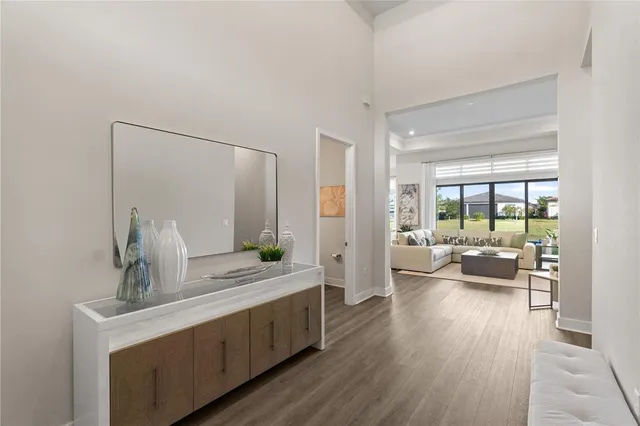 a view of living room with furniture and wooden floor