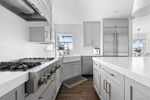 a living room with fireplace furniture and a flat screen tv