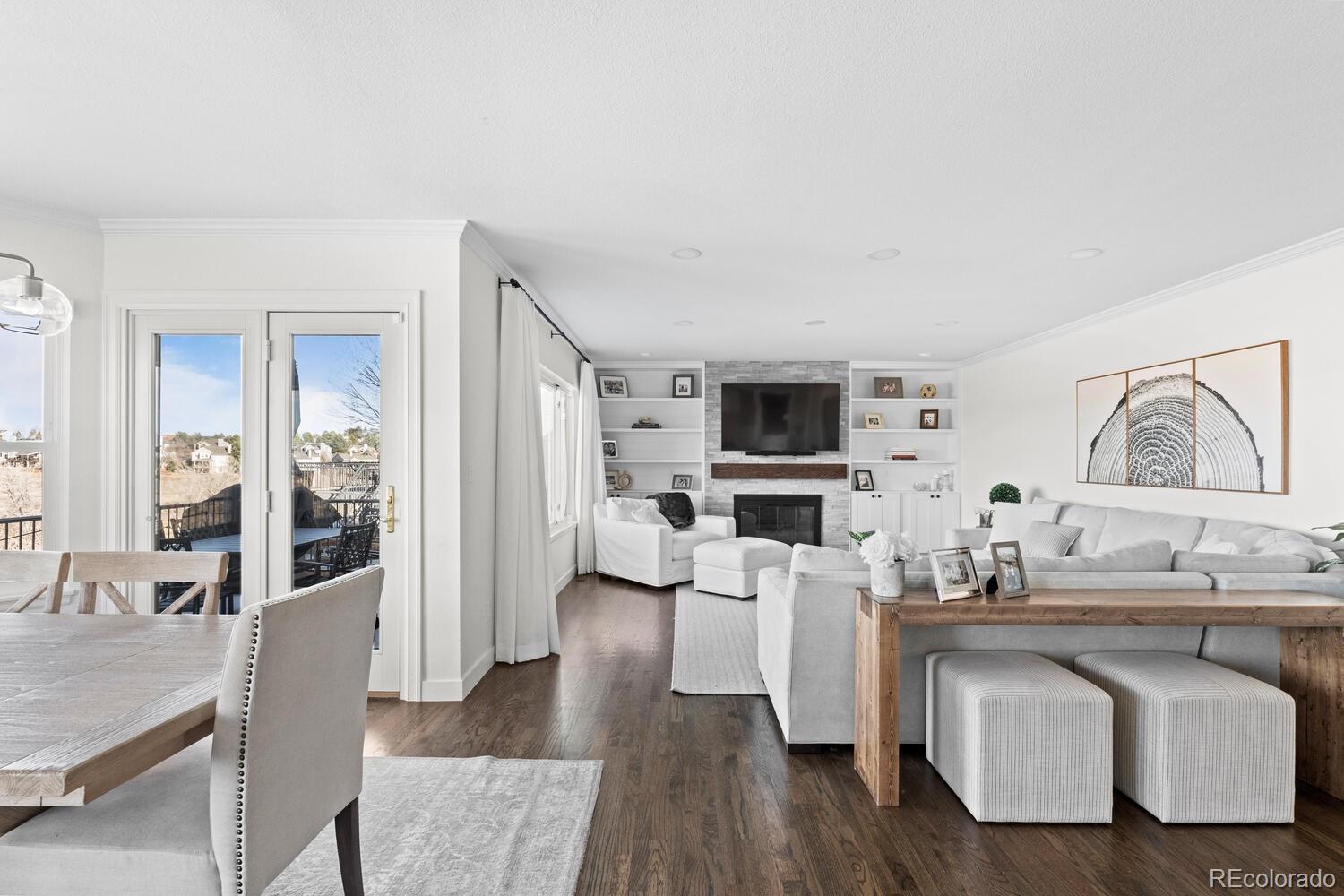 8855 South Wild Iris Run Highlands Ranch, CO 80126 - Photo 13 of 48 a living room with fireplace furniture and a flat screen tv
