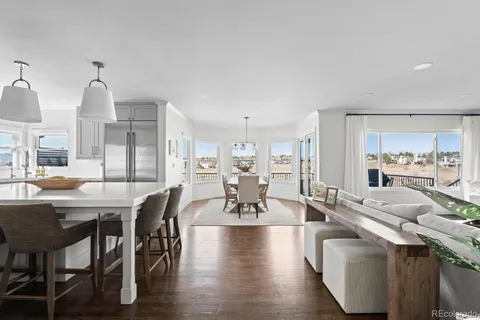 a living room with furniture flat screen tv and a fireplace